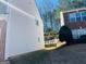 Home's backyard featuring lush greenery, a white picket fence, and a glimpse of the home's siding at 1870 Wildcat Trace Cir, Lawrenceville, GA 30043