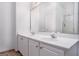 Modern double sink bathroom with white cabinetry, ceramic tile floors, a large mirror, and great lighting at 1870 Wildcat Trace Cir, Lawrenceville, GA 30043