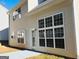 Rear view of the home featuring large windows and a patio area, showcasing the home's natural light at 1870 Wildcat Trace Cir, Lawrenceville, GA 30043