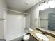 Clean bathroom with a tiled shower/tub, granite countertop, and updated fixtures at 3507 Sage Dr, Lithia Springs, GA 30122