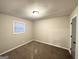 Comfortable bedroom with neutral walls, plush carpeting, and a bright window at 3507 Sage Dr, Lithia Springs, GA 30122