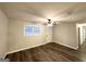 Inviting living room with wood-look flooring, neutral walls, and bright natural light at 3507 Sage Dr, Lithia Springs, GA 30122