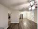 Spacious living room featuring wood-look flooring, neutral walls, and a modern ceiling fan at 3507 Sage Dr, Lithia Springs, GA 30122