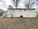 Exterior view of the backyard with partial views of the house and a small staircase at 360 Belgarde Pl, Atlanta, GA 30354