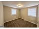 A bright bedroom featuring plush carpeting and two windows that invite ample natural light at 360 Belgarde Pl, Atlanta, GA 30354