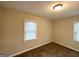 Inviting bedroom with neutral walls, carpeted floors, and natural light from two windows at 2174 Doris Dr, Decatur, GA 30034