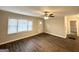 Inviting living room with sleek dark hardwood floors, a ceiling fan, and neutral paint at 2174 Doris Dr, Decatur, GA 30034