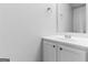 Close up of stylish powder room with white cabinets and mirror at 2916 Ward Lake Way, Ellenwood, GA 30294
