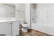 Bright bathroom featuring a tub/shower combo, laminate flooring, and a modern vanity at 2916 Ward Lake Way, Ellenwood, GA 30294