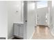 Stylish powder room with white cabinets at 2916 Ward Lake Way, Ellenwood, GA 30294