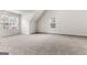 Spacious bedroom featuring plush carpeting, large windows, and ample natural light at 2916 Ward Lake Way, Ellenwood, GA 30294