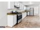 Bright kitchen features white cabinetry, granite countertops, and stainless steel appliances at 2916 Ward Lake Way, Ellenwood, GA 30294