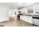 Bright kitchen with white cabinets, granite counters, and stainless steel appliances at 2916 Ward Lake Way, Ellenwood, GA 30294