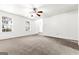 Bright living room with plush carpeting and natural light from large windows at 2916 Ward Lake Way, Ellenwood, GA 30294