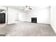 Spacious living room with neutral carpet and a fireplace at 2916 Ward Lake Way, Ellenwood, GA 30294