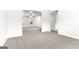 View of a large living area with neutral carpet and an open floor plan at 2916 Ward Lake Way, Ellenwood, GA 30294