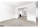 Comfortable living room with plush carpeting, a fireplace, and an open layout at 2916 Ward Lake Way, Ellenwood, GA 30294