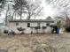 A backyard featuring a brick house, bare trees, and foliage at 312 Fairburn Nw Rd, Atlanta, GA 30331