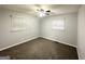 Neutral bedroom with carpet flooring and ample natural light from two windows at 312 Fairburn Nw Rd, Atlanta, GA 30331
