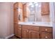 Bathroom featuring wood-look flooring, wooden cabinets, mirror and a sink at 7364 N Mitchell Ct, Villa Rica, GA 30180