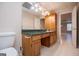 Bathroom vanity with a green countertop and neutral tile flooring at 7364 N Mitchell Ct, Villa Rica, GA 30180