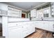 Bright kitchen with white cabinets, granite countertops, and stainless steel appliances at 7364 N Mitchell Ct, Villa Rica, GA 30180