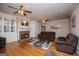 Cozy living room with a brick fireplace, built-in cabinets, and comfortable seating at 7364 N Mitchell Ct, Villa Rica, GA 30180