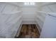 Pantry with wood-look flooring and white metal shelving at 7364 N Mitchell Ct, Villa Rica, GA 30180