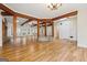 Expansive living area featuring hardwood floors, skylights, a stone column, and an open layout for versatile living at 465 Camelot Dr, Fayetteville, GA 30214