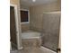 Bathroom showcases a large soaking tub and a separate glass-enclosed shower at 10020 Crystal Ter, Jonesboro, GA 30238