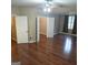 Bright primary bedroom features hardwood floors, a ceiling fan, and a spacious walk-in closet at 10020 Crystal Ter, Jonesboro, GA 30238