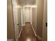 Hallway with wood floors and access to rooms at 10020 Crystal Ter, Jonesboro, GA 30238