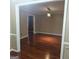 Cozy living room with hardwood flooring, stylish lighting, and neutral wall colors for a warm ambiance at 10020 Crystal Ter, Jonesboro, GA 30238