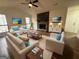 Bright living room with vaulted ceiling, stone fireplace, and luxury vinyl plank flooring at 115 Paces Way, Fayetteville, GA 30215