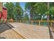 Spacious wood deck with beautiful lake views, ideal for outdoor entertaining at 6337 Lakeview Dr, Buford, GA 30518