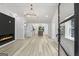 Bright living room featuring an electric fireplace, luxury vinyl plank flooring, and elegant lighting at 6337 Lakeview Dr, Buford, GA 30518