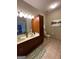 Bathroom features a double vanity with a large mirror, ample lighting and a tiled floor at 870 Nw Mayson Turner Nw Rd # 1227, Atlanta, GA 30314