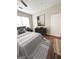 Bedroom featuring hardwood floors, a light grey colour scheme and a large window at 870 Nw Mayson Turner Nw Rd # 1227, Atlanta, GA 30314