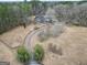 Aerial view of a home on expansive lot with curved driveway and mature trees at 125 Keyland Dr, Fayetteville, GA 30215