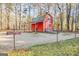 Rustic red barn with horse parking in rear sign at 125 Keyland Dr, Fayetteville, GA 30215