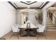 Sophisticated dining room showcases a long marble table, stylish chairs, modern chandelier, and elegant decor at 532 Saint Sambar Dr, Ellenwood, GA 30294