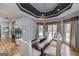 Formal dining room with a modern chandelier, custom trim, and a large wooden table for elegant entertaining at 2802 Players Dr, Lake Spivey, GA 30236