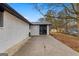 The backyard features a concrete patio and black framed glass doors at 6973 Stephens Dr, Rex, GA 30273
