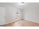 Bright bedroom with a large window and neutral paint, featuring hard surface floors at 6973 Stephens Dr, Rex, GA 30273