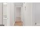 Hallway view that showcases the natural light and the updated finishes throughout at 6973 Stephens Dr, Rex, GA 30273