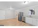 Bright kitchen featuring stainless steel appliances, granite countertops, and classic white cabinets at 6973 Stephens Dr, Rex, GA 30273