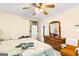 This bedroom features a ceiling fan and a wood dresser at 62 Honey Ln, Mcdonough, GA 30252