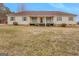 Charming single-story home featuring a cozy front porch, neutral siding, and meticulously kept lawn at 62 Honey Ln, Mcdonough, GA 30252