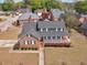 Aerial view of a residential neighborhood with well-maintained homes and landscaping at 135 Oakpark Ter, Mcdonough, GA 30253