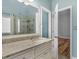 Bathroom boasts neutral palette, granite counters, framed mirror, and tub/shower combo at 135 Oakpark Ter, Mcdonough, GA 30253
